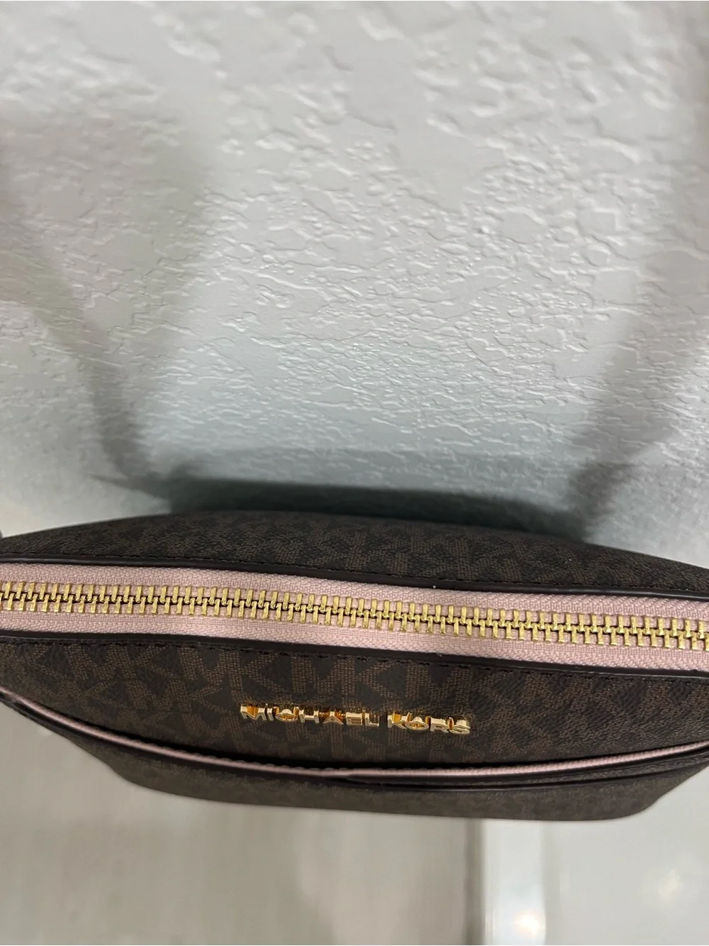 Michael Kors Brown Monogram Crossbody with Pink Trim and Gold Chain Brand new .